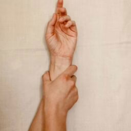 person holding their wrist