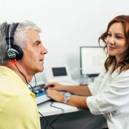 Man gets a hearing test.