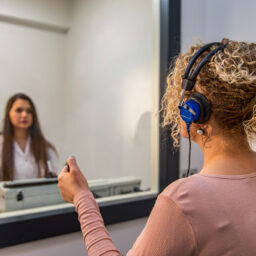 Woman taking a hearing test.
